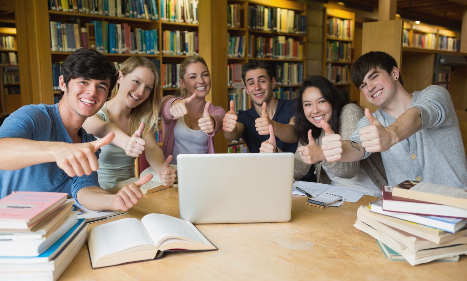 Group of students giving thumbs up