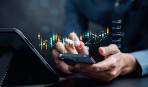 Businessmen investor think before buying stock market investment using smartphone to analyze trading data. investor analysis with stock exchange graph on screen. Financial stock market.